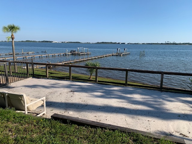 Sand area off side of pool looking over Santa Rosa Sound and property's private boat dock - 1561 US-98