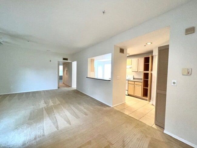 Building Photo - Move in NOW- Spacious 2 bedroom 1 bath condo on 3rd floor in gated community! Water included with...