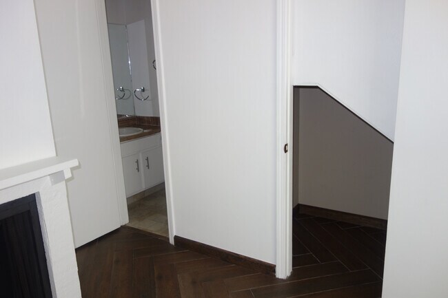 Half bath on left and understairs storage on the right - 3421 E 35th St