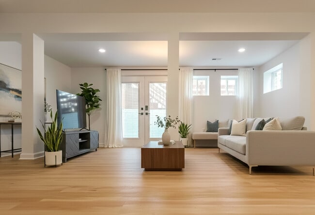 pacious multi-purpose room with fireplace and French doors (2025 addition) - 6471 Grommet Dr