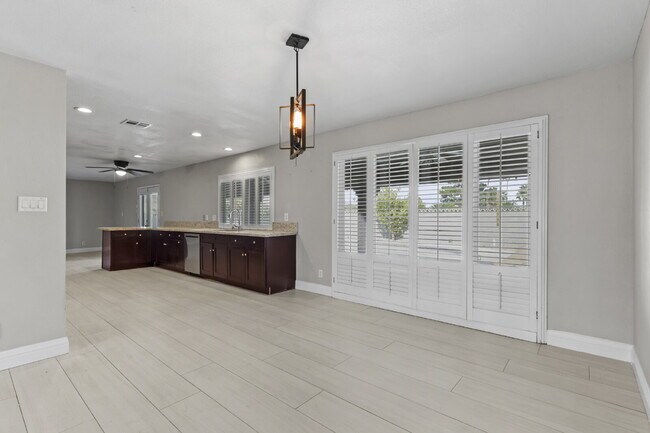 Building Photo - Welcome to your entertainers dream home with solar and pool service included!