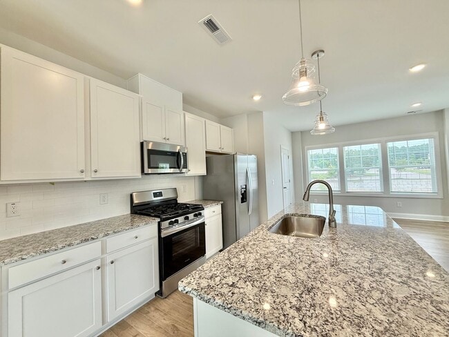 Building Photo - Stunning End Unit New Construction 3BD, 3....