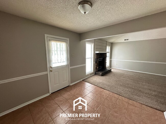 Building Photo - Charming 3BR/2BA in Country Brook | Vaulted Ceilings, Fireplace & Fenced Yard