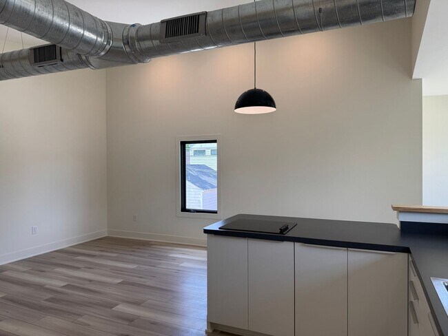 Building Photo - Vaulted Ceilings & Hardwood Floors in This Charming Indianapolis L
