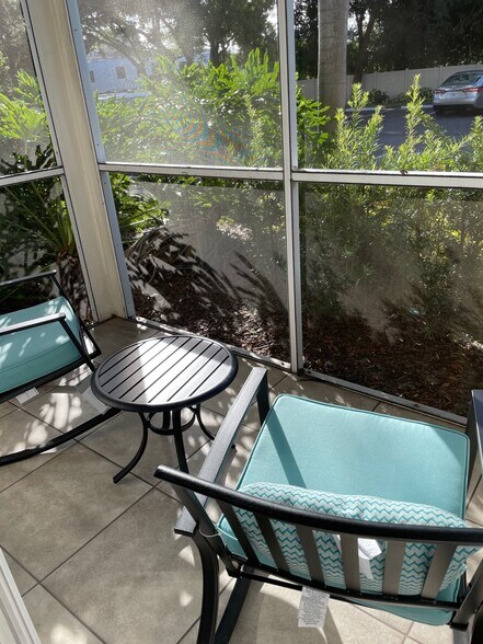 Screened-in patio off the living room. - 850 S Tamiami Trl