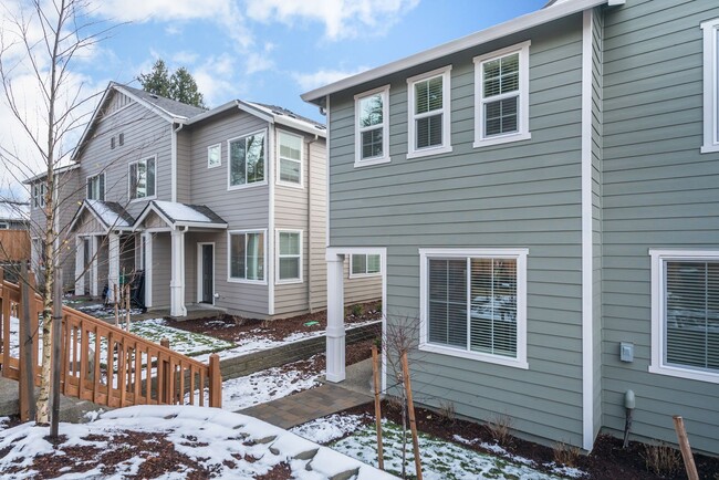 Building Photo - Super clean & spacious 4-bdrm/3-bath townhome in NE—Attached garage, great location