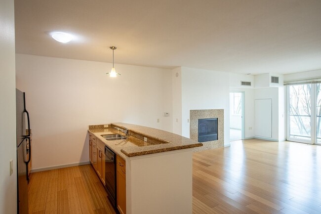 Building Photo - Sweet + secure 1/1 condo with parking, extra storage room + AC available now!