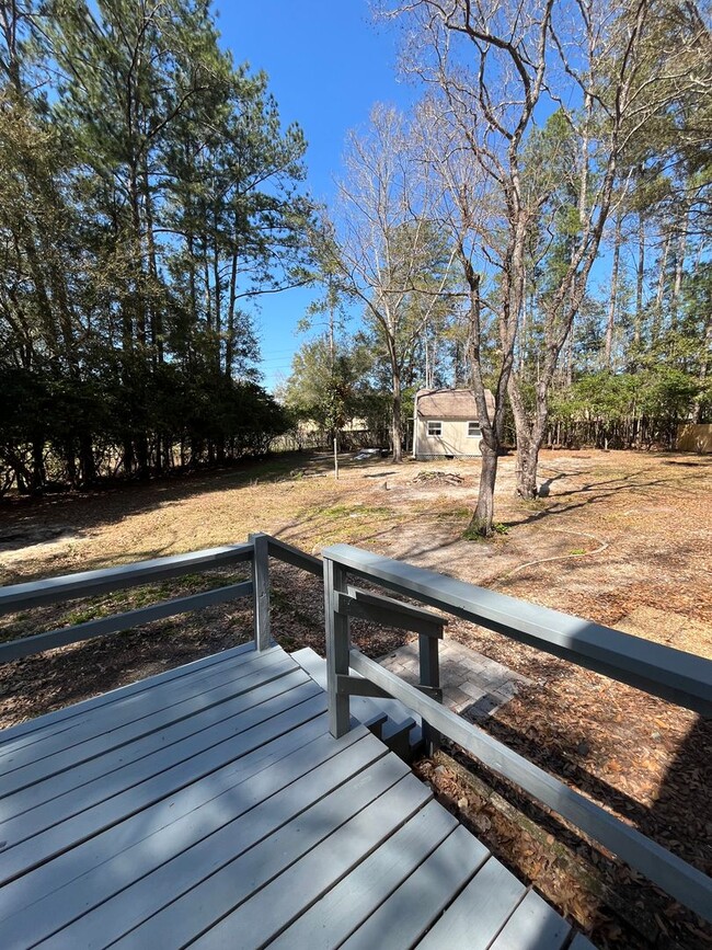 Building Photo - 3/2  home fenced in backyard located acros...