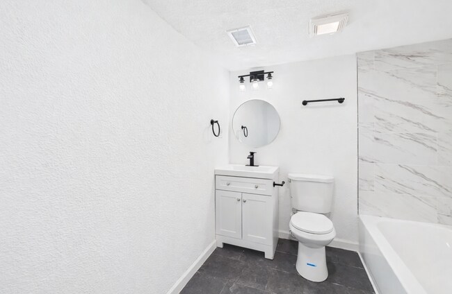 Building Photo - Stylishly Updated 4BR/3BA with Expansive Back Deck