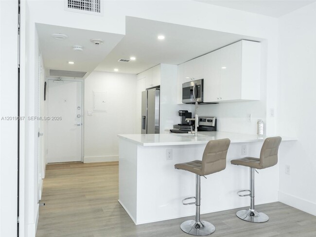 Building Photo - 10275 Collins Ave