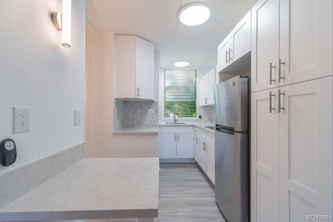 Building Photo - RECENTLY RENOVATED GROUND FLOOR PUALEI CIR...