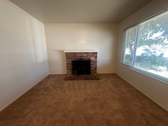 Building Photo - Three Bedroom Two Bathroom Home with Yard