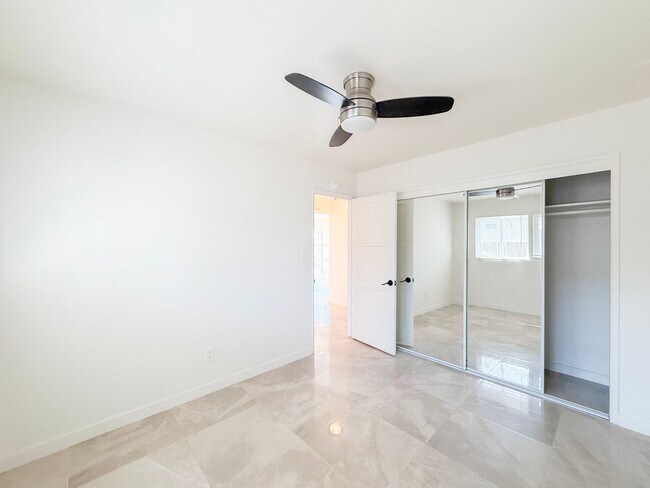 Building Photo - Renovated Triplex with Private Yard, AC, and Parking