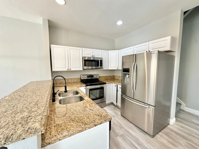 Building Photo - Corner Unit Two Story Townhome in the Beau...