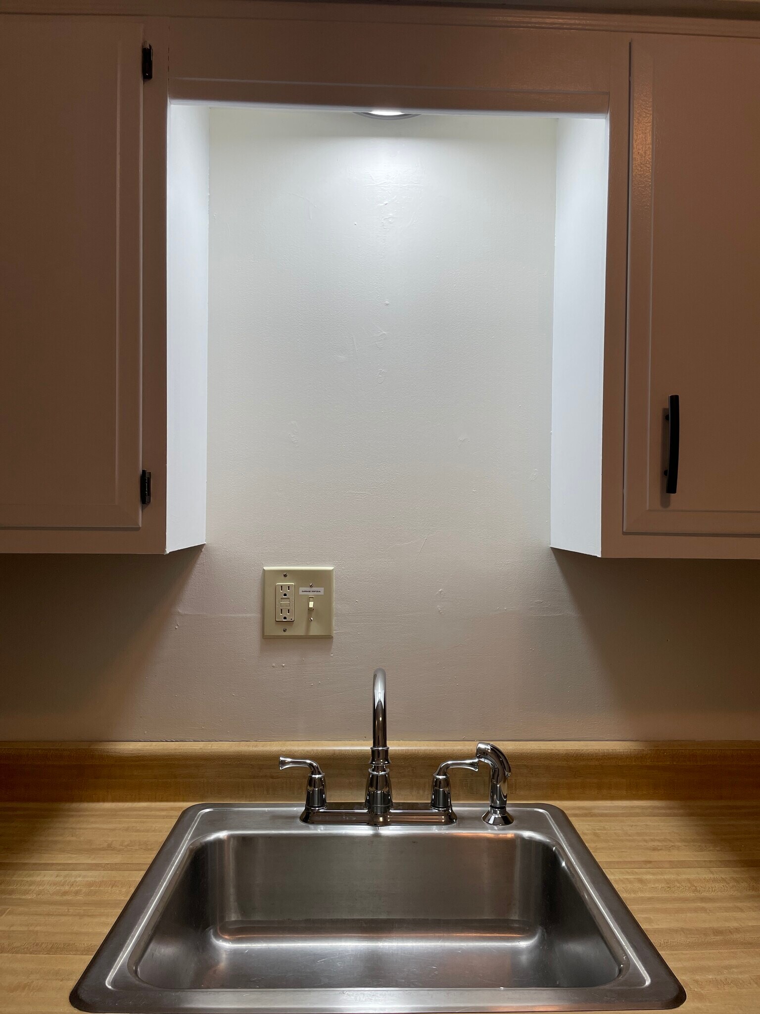 Large stainless steel kitchen sink with new faucet, sprayer, and garbage disposal - 5523 Ellsworth Ave
