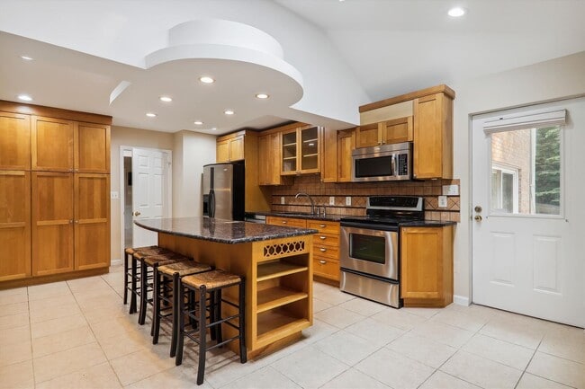 Building Photo - 5 BR 4.5 BA home with inground heated pool and extensive hardscape!