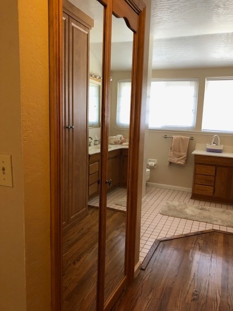 Tile floor in bathroom and mirrored closet - 819 Rubis Dr