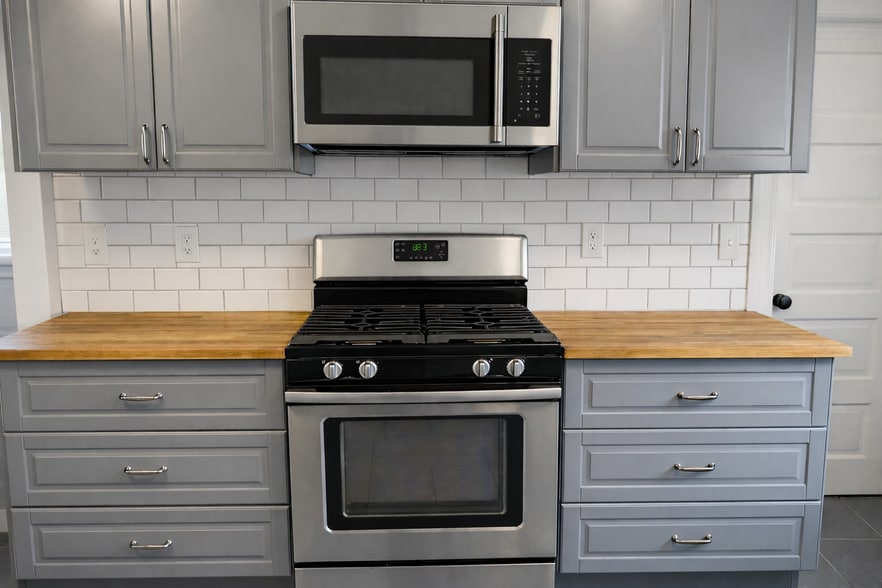 Hidden spices drawers in the top utensil drawers and a gas range. - 604 NE Shaver St