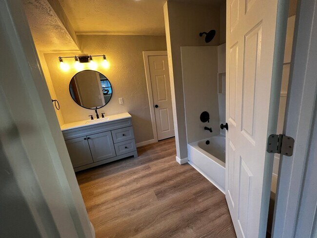 Building Photo - Spacious 4-Bedroom Home with Finished Basement & Garage