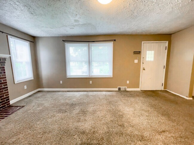Building Photo - PRELEASING for AUGUST! Walk to Ball State! Bright 4BR Home with Fireplace