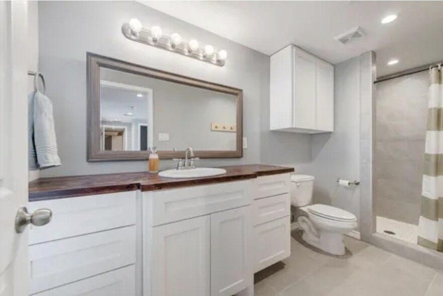 Master bathroom with single vanity sink, lots of counter space, and a walk in shower with 2 shower h - 4327 Ohio Garden Rd