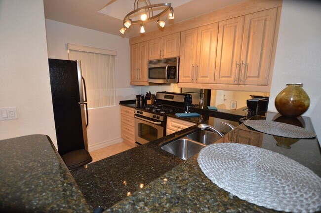Building Photo - Charming Furnished Studio with Large Patio...