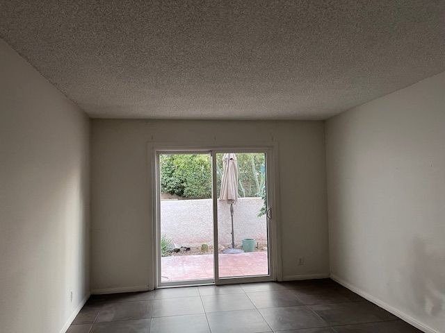 Primary bedroom with separate access to outdoor patio. - 250 E San Jose Rd