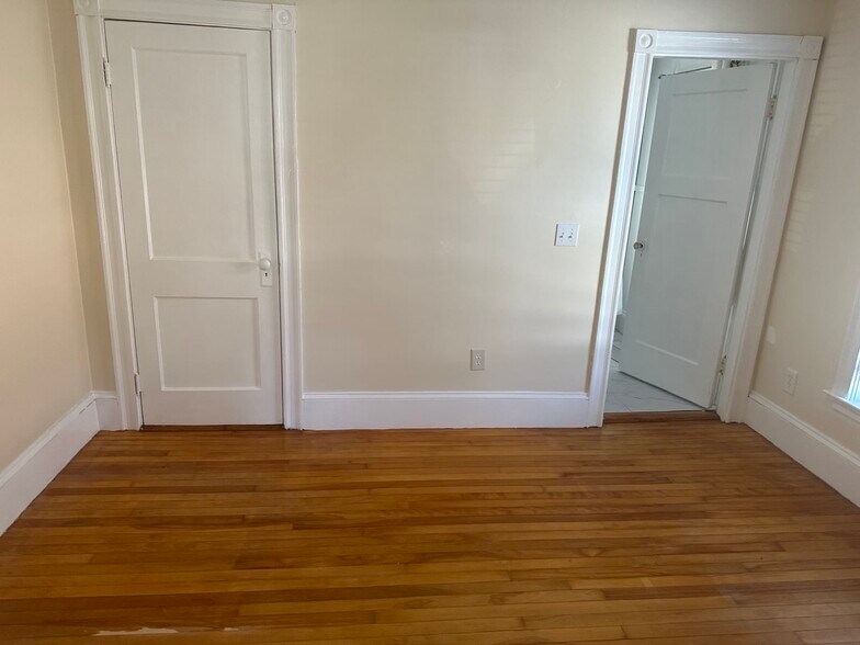 Bedroom 1, closet on left, bathroom door on right - 19 Elsmere Ave