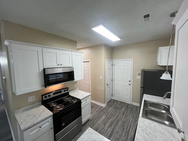 Building Photo - Welcome to Timbertop5127, a well-appointed 4-bedroom, 2.5-bath home in Charlotte, NC.