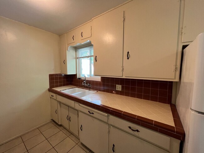 Building Photo - Two-bedroom single story unit with a carport!