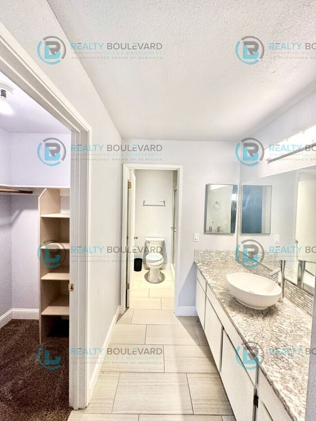 Building Photo - 1/2 Month Free!! Indulge in comfortable living at Wood Chase Condos!