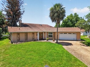 Building Photo - Available Now! Unique Canal-Front Pool Home with Boathouse & Chain of Lakes Access