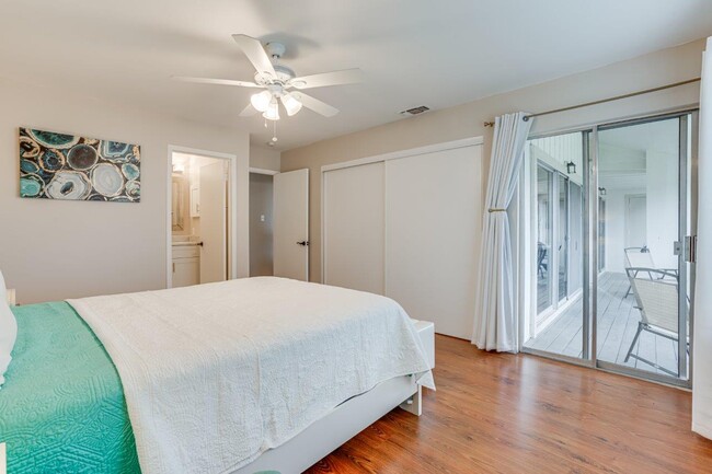 A big closet contains a cabinet with a Roku TV - 2004 Lakeland Dr