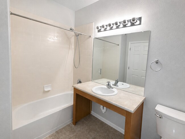 Building Photo - Spacious 2-Bedroom Condo with Garage, Fireplace, Pool & Most Included Utilities