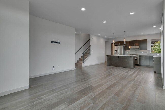 Building Photo - Modern Townhouse with Rooftop Deck & Skyli...