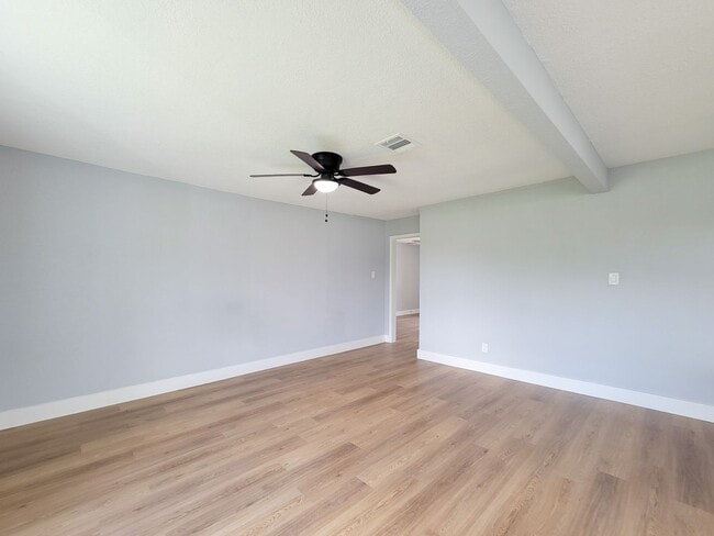 Building Photo - This beautifully updated 4-bedroom home is just under two miles from Highway 288 and Loop 610, ma...
