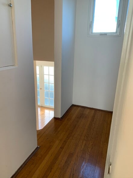 Upstairs hallway leading down to main level. - 1903 Sacramento St