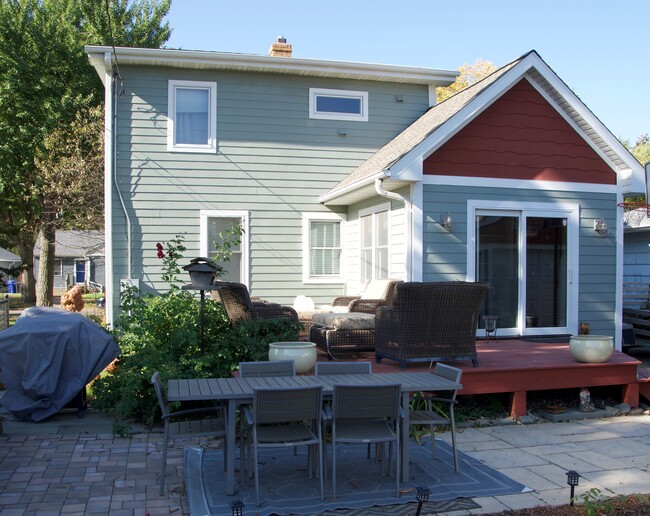 Back of home - deck, patio, backyard with raised beds for gardening and fire pit area - 1482 Cohansey St