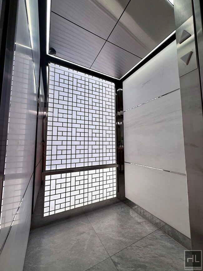 Building Photo - SUNNY NO FEE STUDIO IN THE LUXURY SUMMIT NYC
