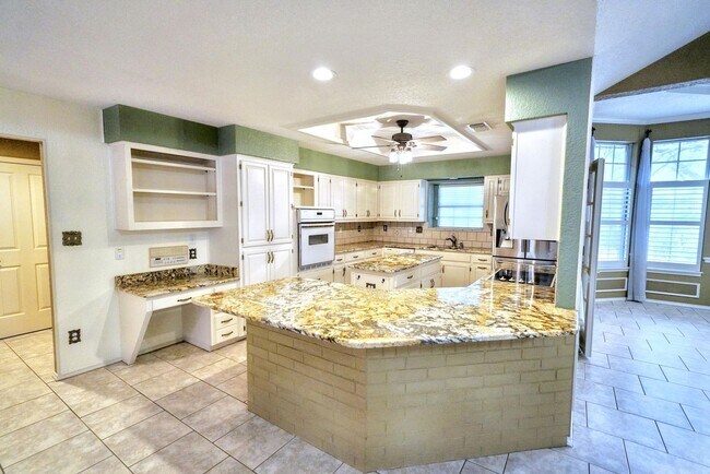 Building Photo - Executive Home in Greenshire with Luxurious Updates and Spacious Outdoor Living - Agent Commissio...