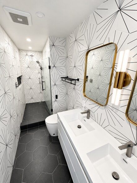 Modern bathroom with double vanity and walk-in shower. - 826 San Pablo Ave