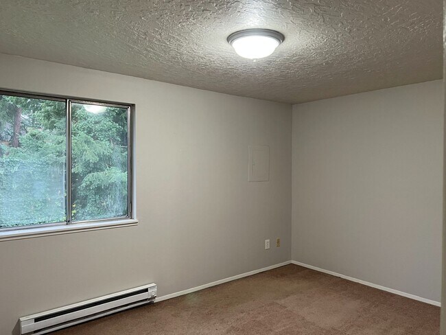 Building Photo - NEWLY REFRESHED Two Bedroom Townhome Style...