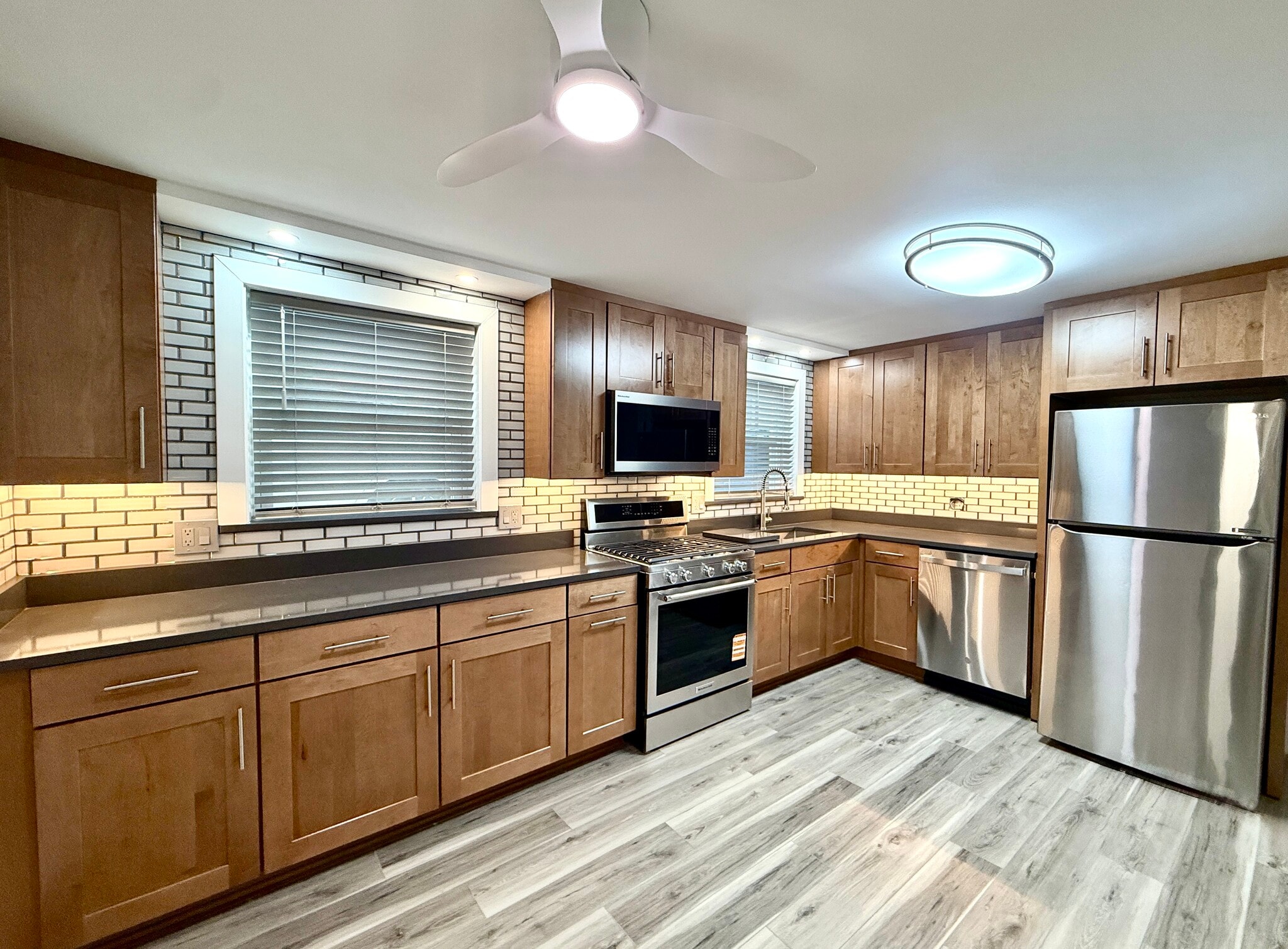 Fully remodeled kitchen w/ new cabinets & quartz counters, S/S appliances & solid plank flooring! - 16W671 56th St