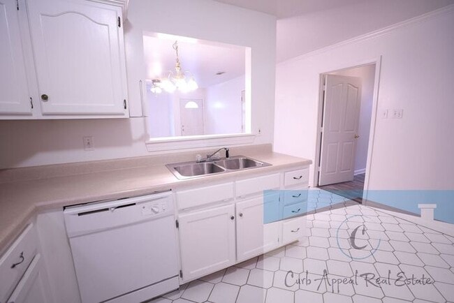 Building Photo - First month move in special $900!! Beautiful 3-bed, 2 bath condo with 2-car garage - includes was...