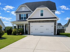 Building Photo - Spacious Elegance Awaits: 4-Bedroom Gem with Granite Countertops on Harrington Road!