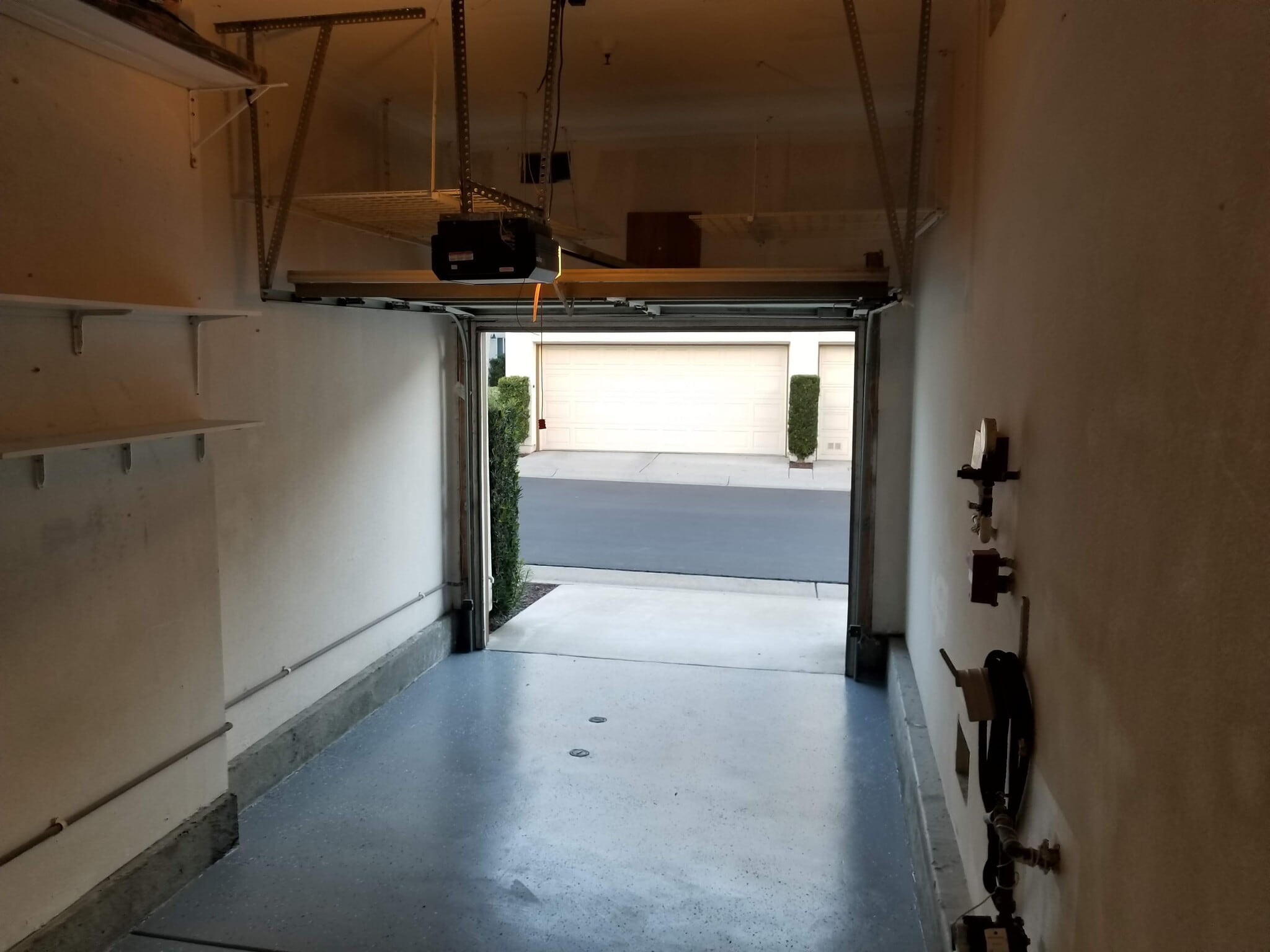 Attached garage with ceiling mounted storage - 16939 Robins Nest Way