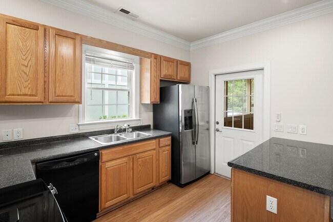 Building Photo - Five-Bedroom Tudor Home with Main-Level Primary Suite in Albemarle Reserve