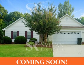 Building Photo - This home exudes a cheerful and welcoming charm!