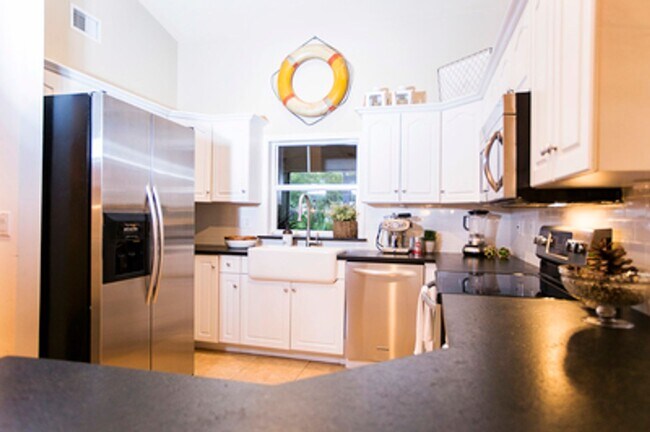 Building Photo - ANNUAL RENTAL - Beach Cottage with 2 Car Garage 'The Lakehouse' in tropical garden