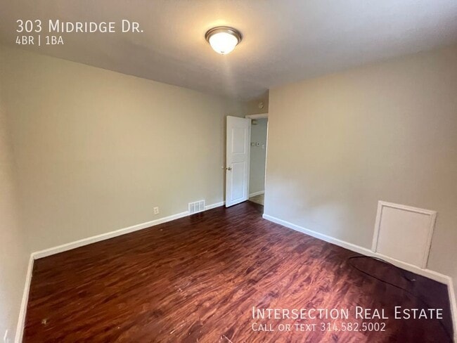 Building Photo - 303 Midridge Dr